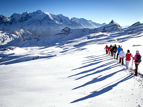 snowshoes walk in courchevel 1850 with a guide